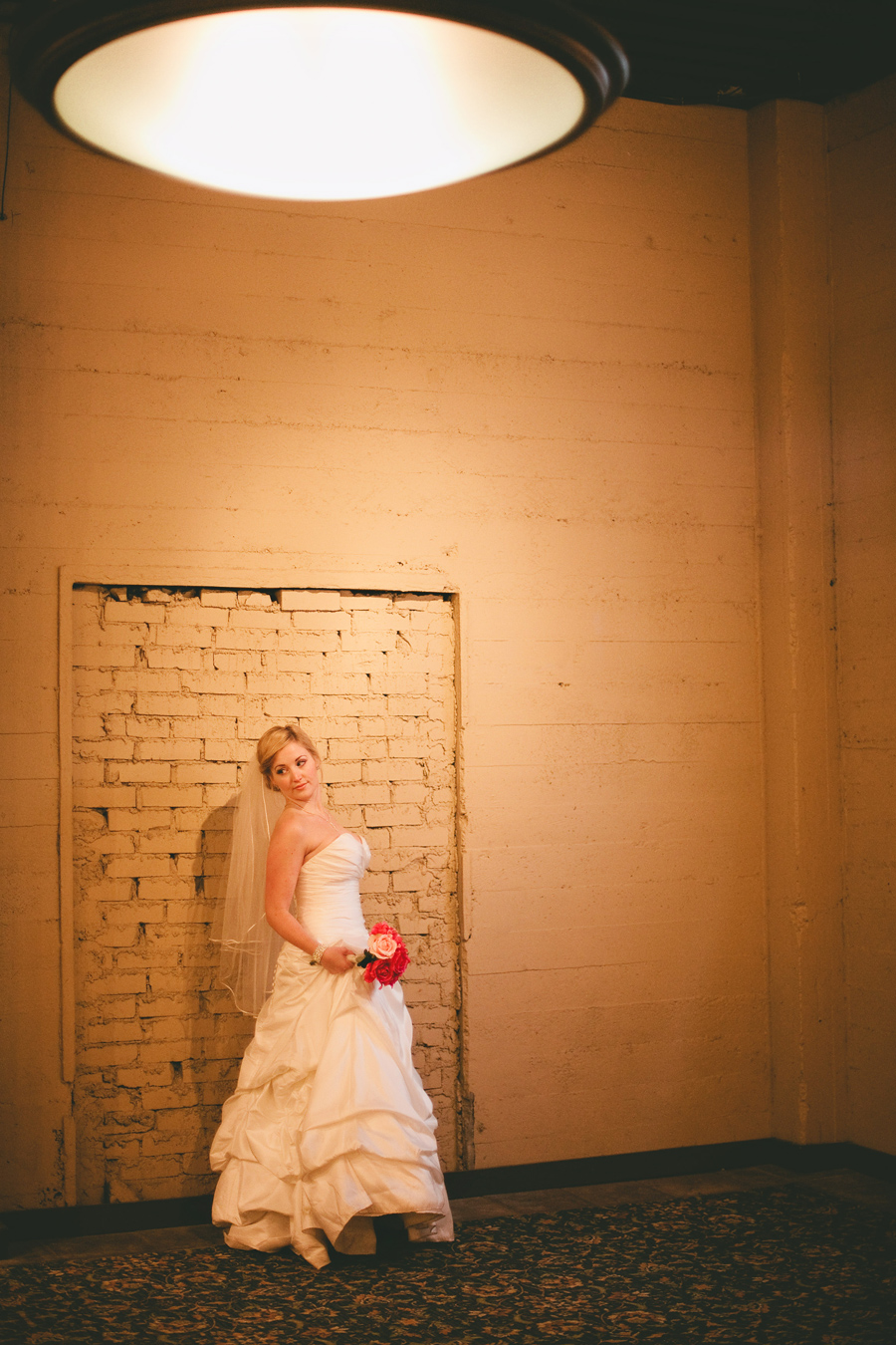 A beautiful portrait of the bride next to original stonework at the Los Gatos winery.