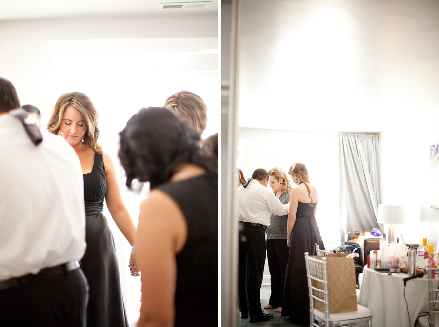 The bridal party prays over the bride before the wedding ceremony at Willow Heights.