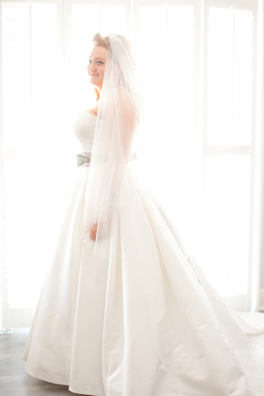 A bridal portrait next to the window at Willow Heights Mansion.