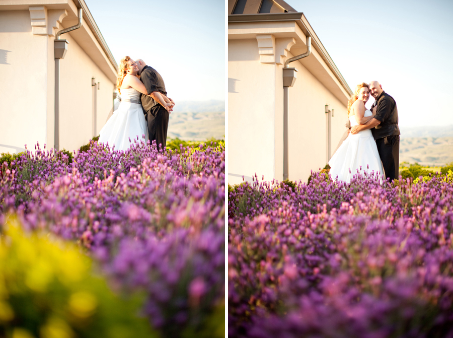 The bride and groom hug in front of a sea of purple flowers outside the Willow Heights Mansion.