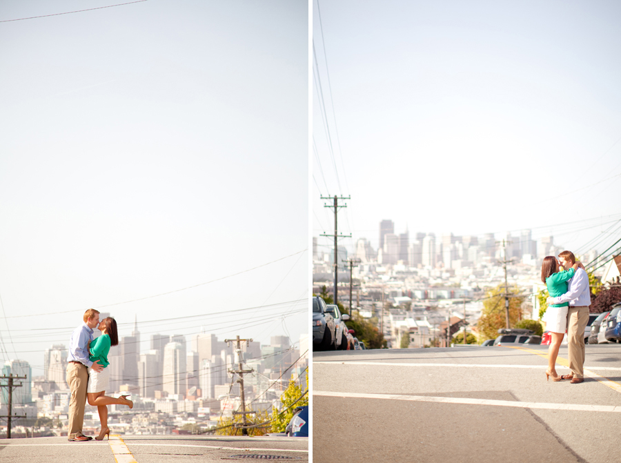 The couple stands in the street to the skyline view of San Francisco.