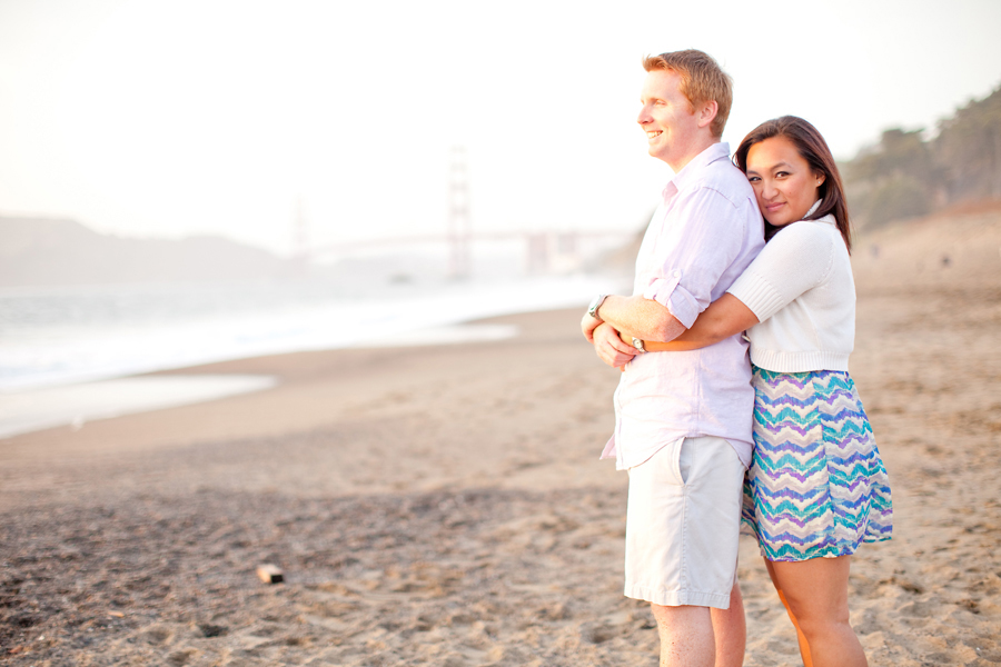 Sarah hugs Kyle as they enjoy the beach in San Francisco.