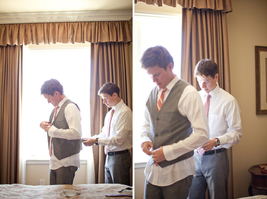The best man helps the groom get ready before the wedding.