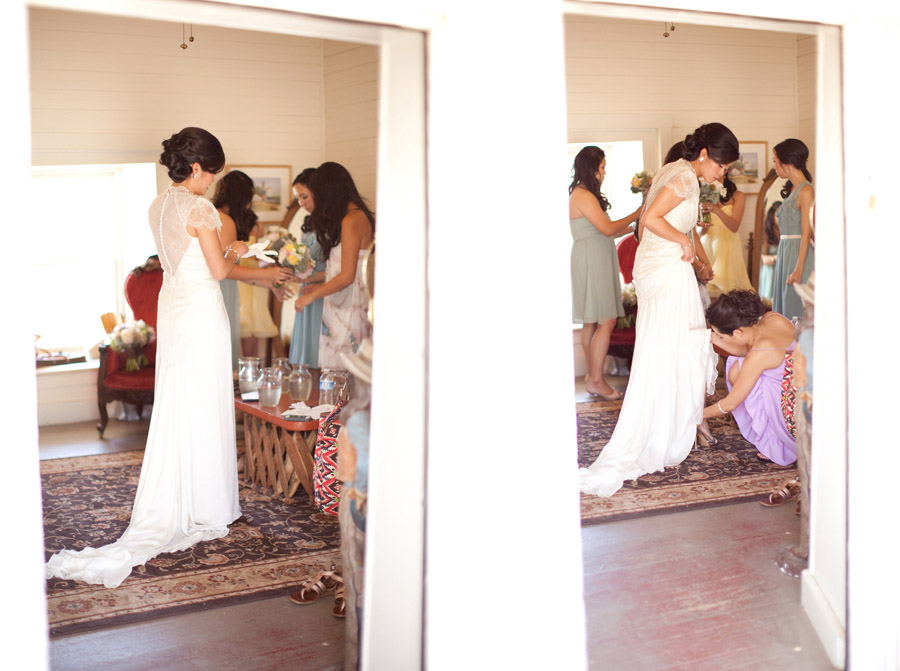 Bridesmaids help the bride put on her shoes and gloves before the ceremony at Santa Margarita Ranch.