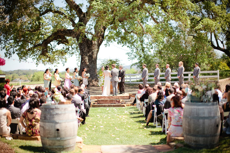 At Santa Margarita Ranch, the couples gets married next to a large oak tree.