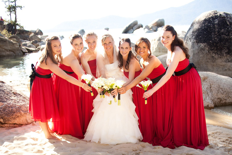 The bride and bridesmaids show off their flowers at Sand Harbor State Park.