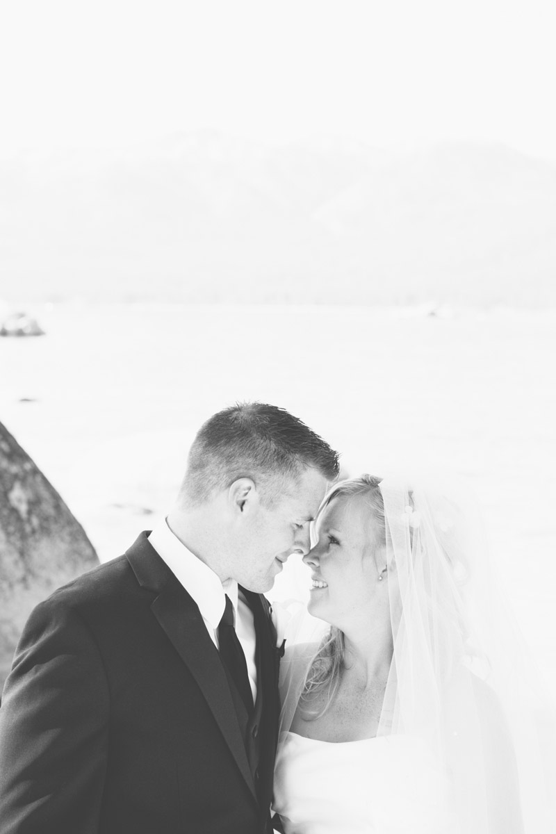 The bride and groom look into each other's eyes at Lake Tahoe.