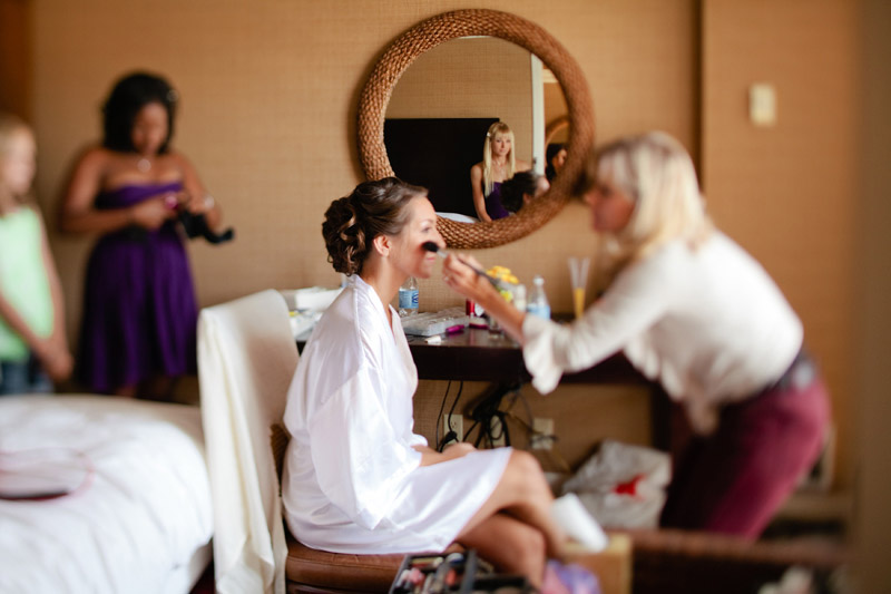 Makeup touchups before the wedding in Monterey.
