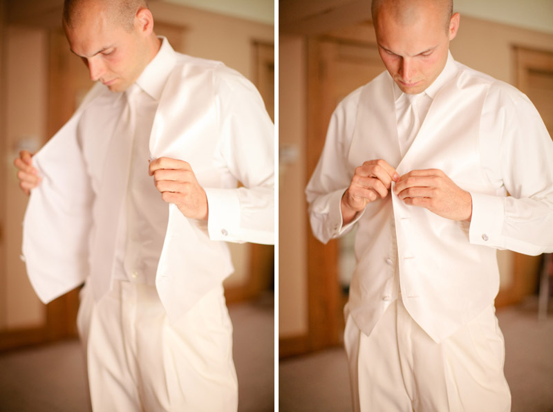 Jordan, the groom, puts on her vest in preparation for the wedding ceremony.