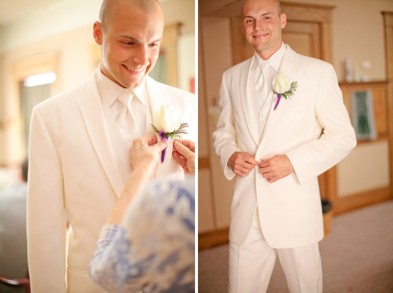 Jordan puts his tuxedo jacket on with his boutonniere before the wedding ceremony in Monterey.