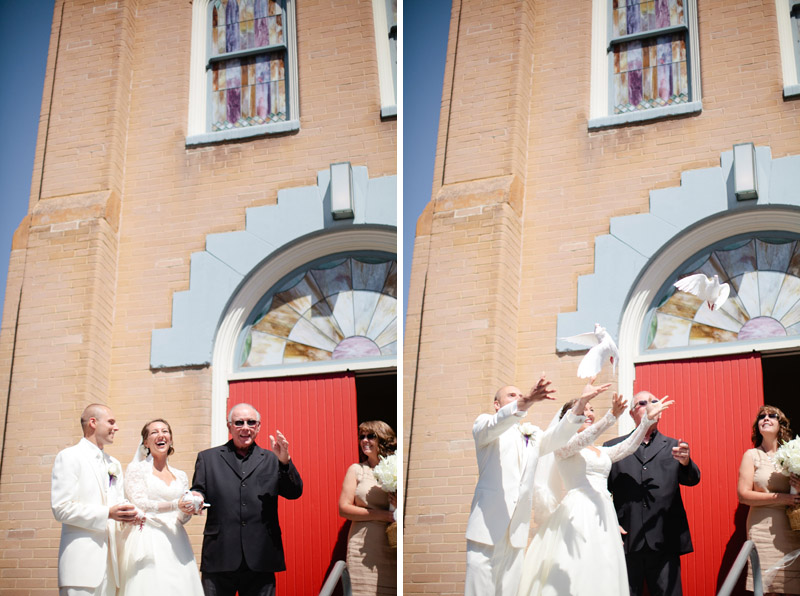 Brittany and Jordan let doves go outside of the church after their wedding.
