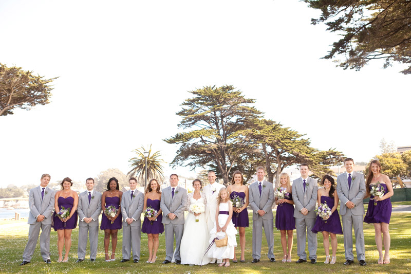 The bridal party lines up at Lover's Point in Monterey after the wedding.