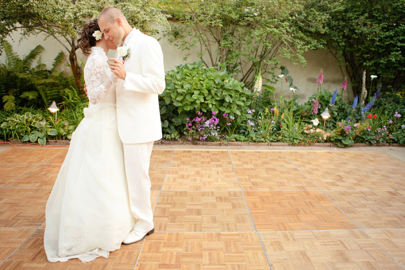 The bride and groom dance to their first dance after their wedding in the Memory Gardens.