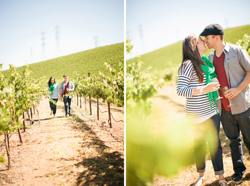 Alyssa and Nate kiss while enjoying wine in the vineyards at Murrieta's Well.