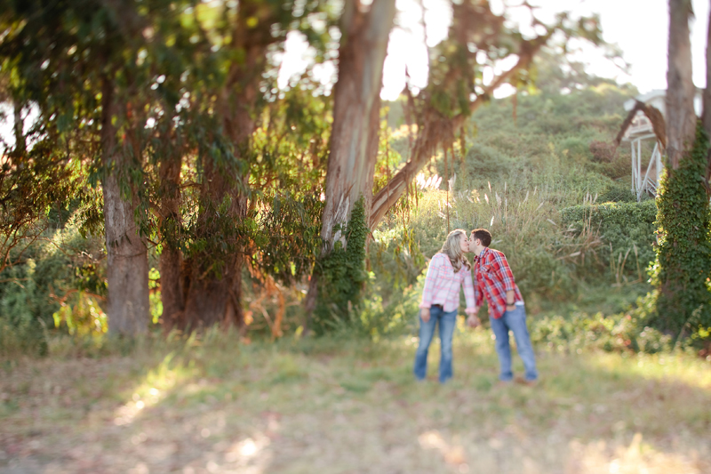 In the Santa Cruz trees, the couple kiss before heading to the beach.