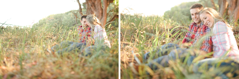 Alison and Piero laugh and talk in the tall grass about their engagement pictures in Santa Cruz.