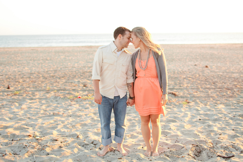 The two put their heads together at the beach in Santa Cruz for engagement pictures.