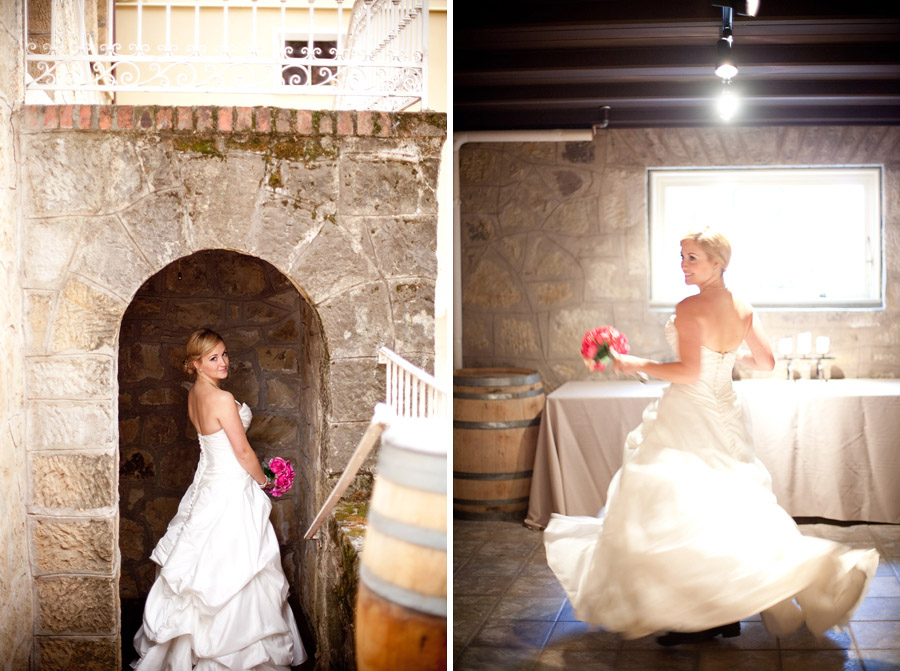 Bride stands in stone archway towards a small room at the Los Gatos winery.